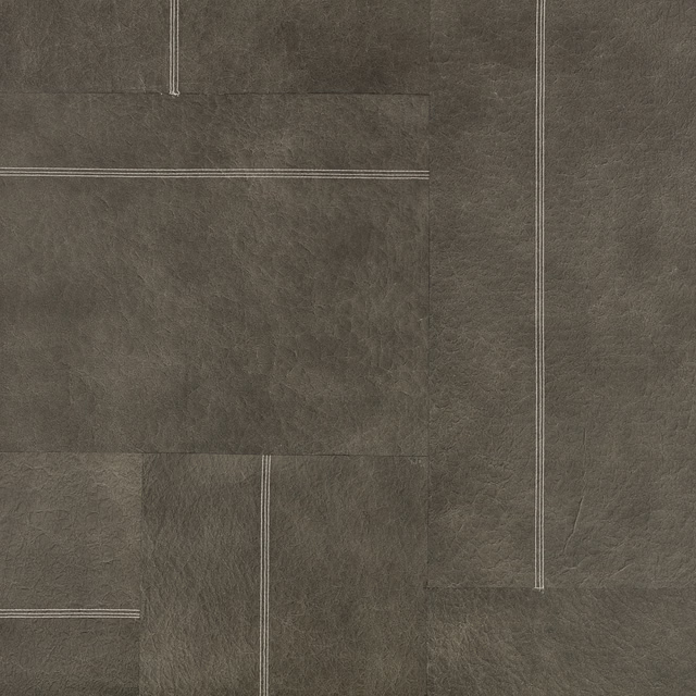 Deep taupe-brown wallcovering with pale outlined panels and cloudy tactile texture