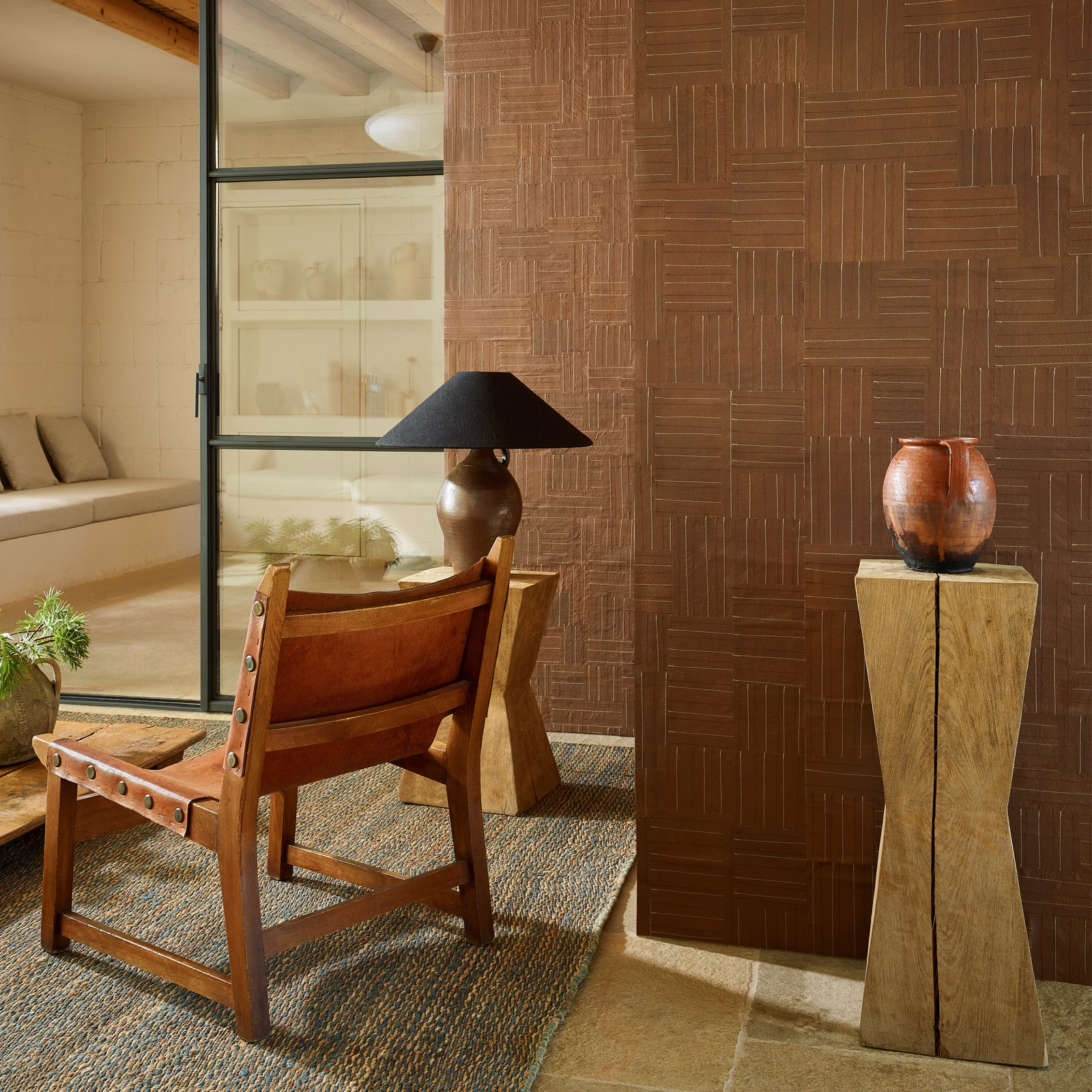 Warm paprika-brown wallcovering with fine rectangular linear pattern beside timber furniture