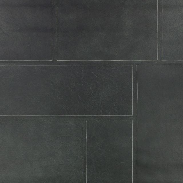 Deep indigo-blue wallpaper with pale rectangular lines and a softly weathered texture