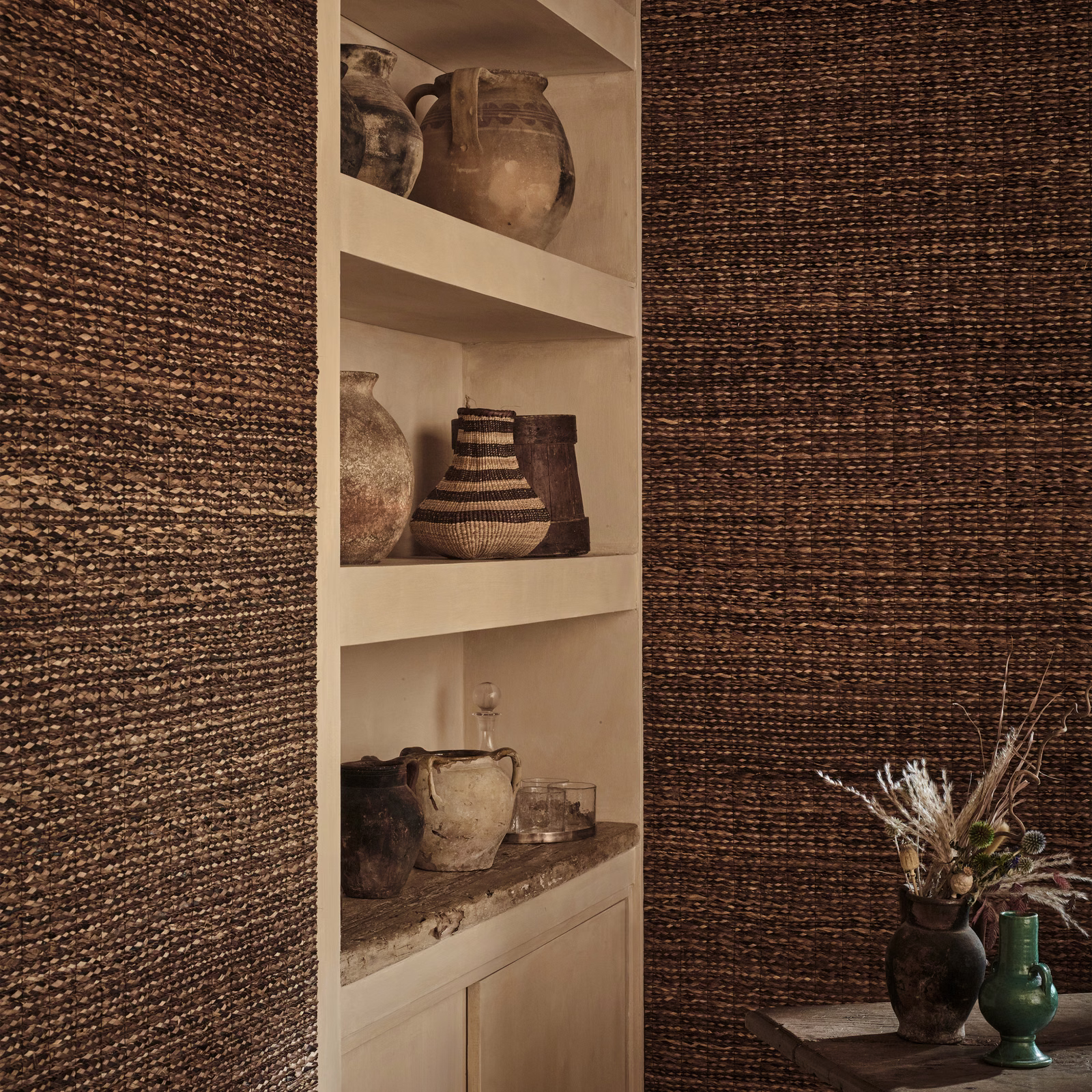 Deep bark-brown wallpaper with fine horizontal woven lines and tan tonal flecks
