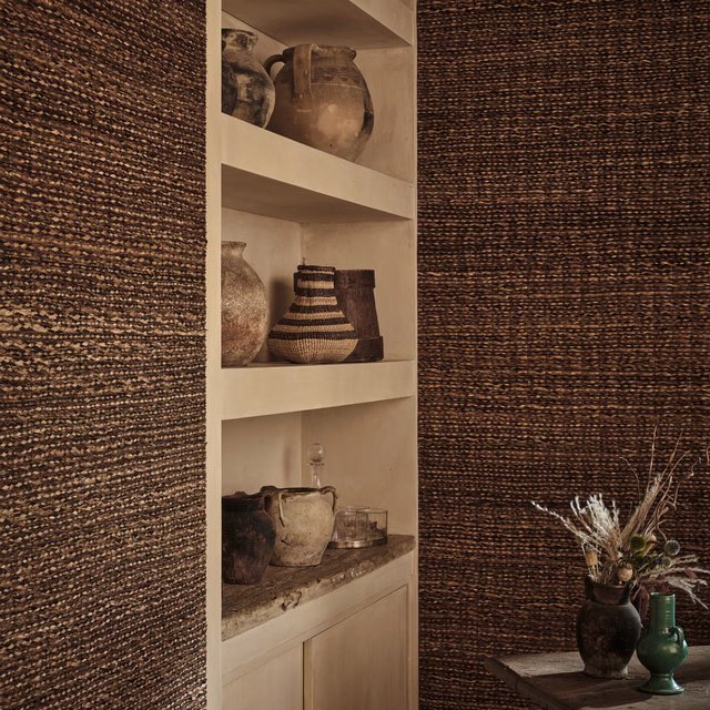 Deep bark-brown wallpaper with fine horizontal woven lines and tan tonal flecks