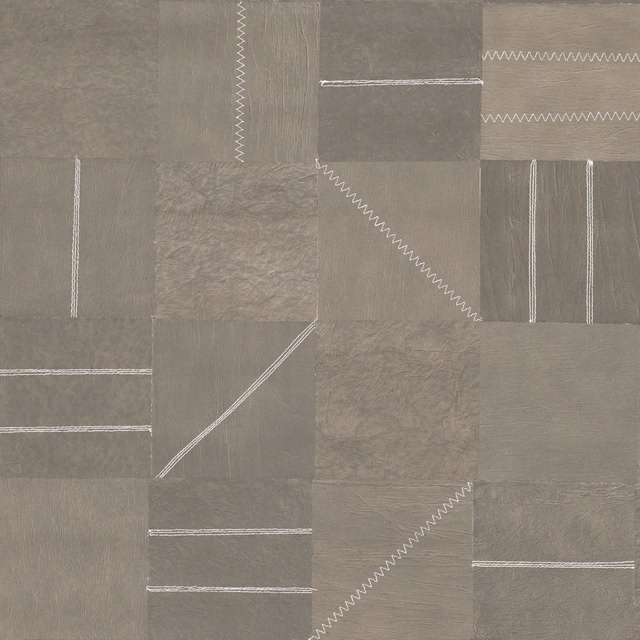 Muted taupe-grey patchwork wallpaper with white zigzag stitch lines and tonal panels