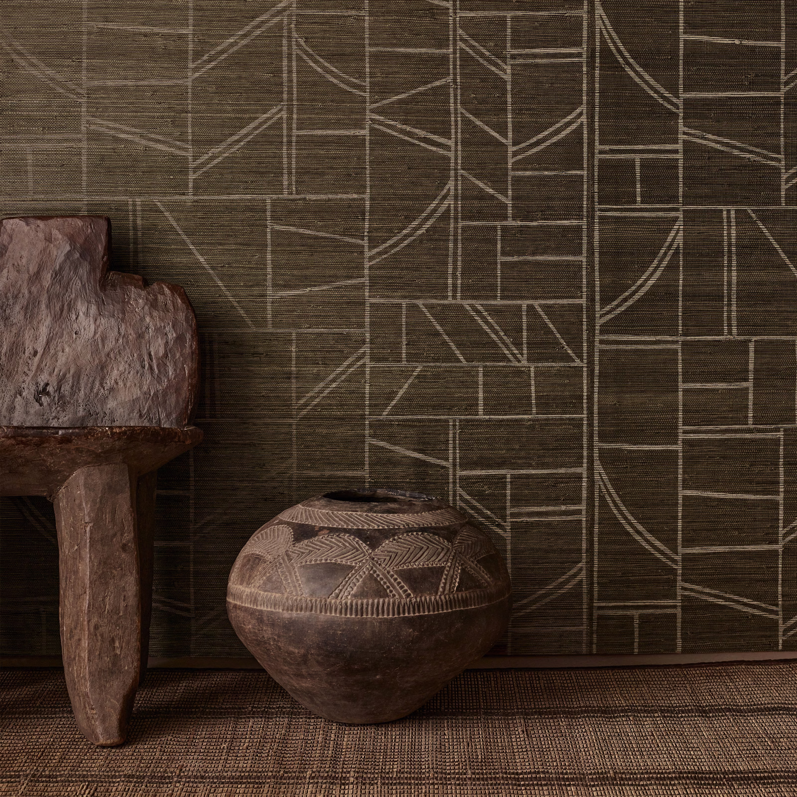 Dark loam-brown wallpaper with pale geometric lines over a fibrous horizontal ground