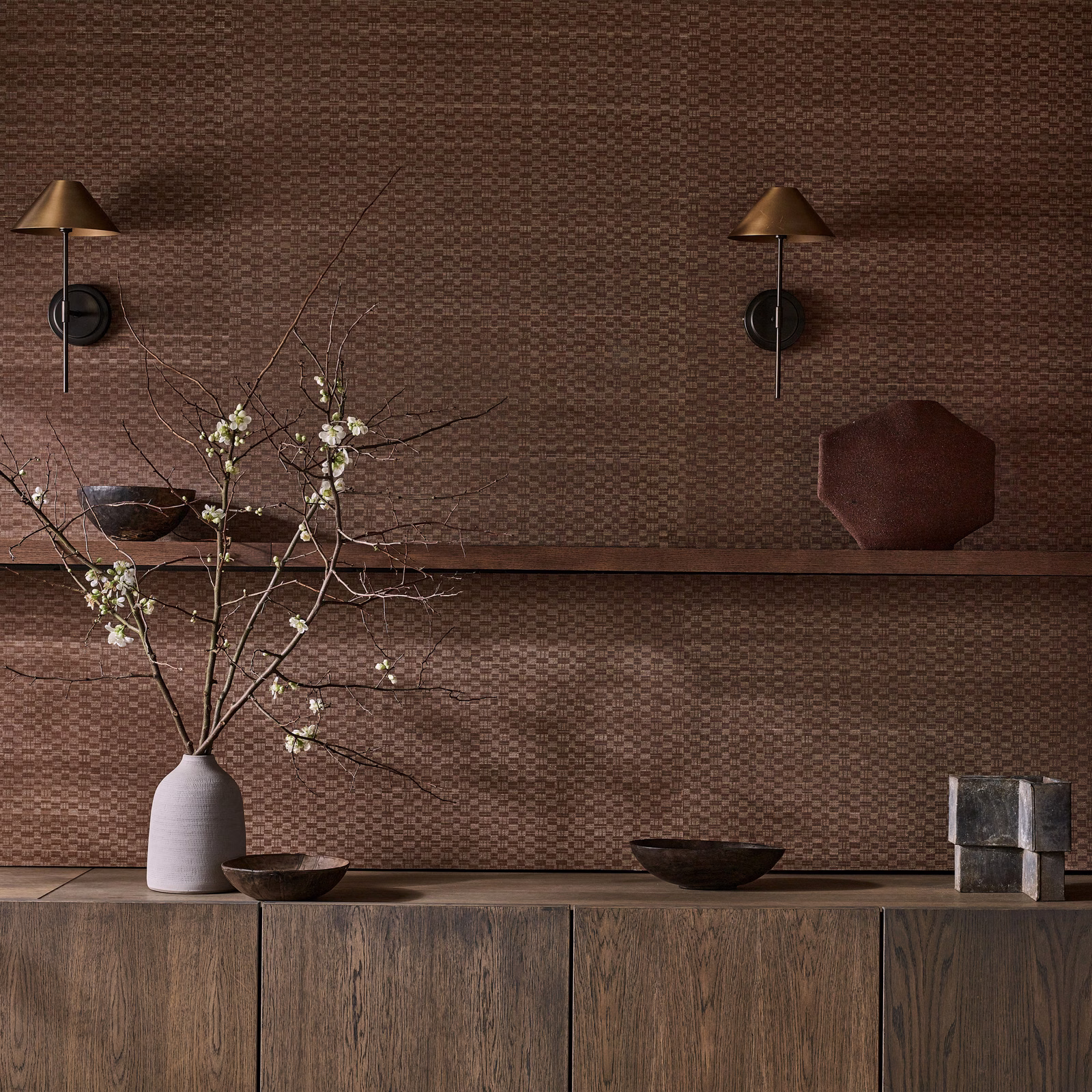 Warm paprika brown wallpaper with a fine woven check pattern catching soft light