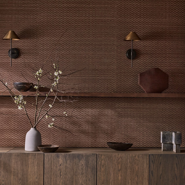 Warm paprika brown wallpaper with a fine woven check pattern catching soft light