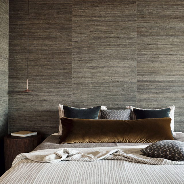 Deep gunmetal grey raffia wallpaper with horizontal fibres and tonal panel shifts