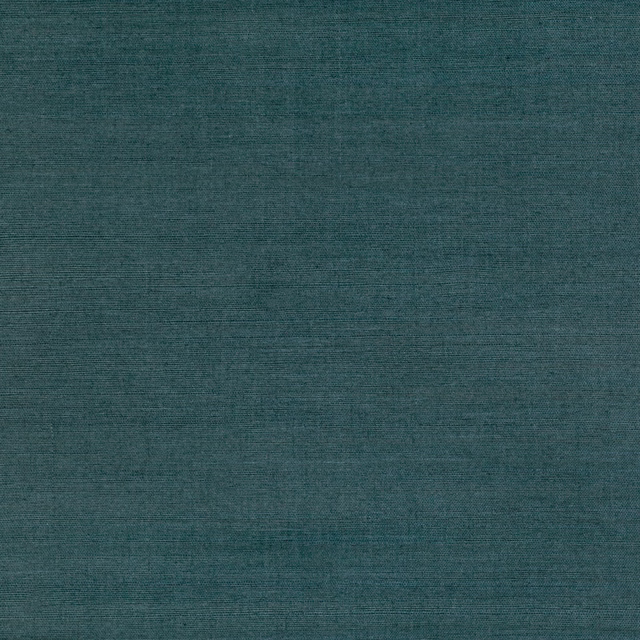 Close-up of deep teal wallpaper with fine horizontal grasscloth striations
