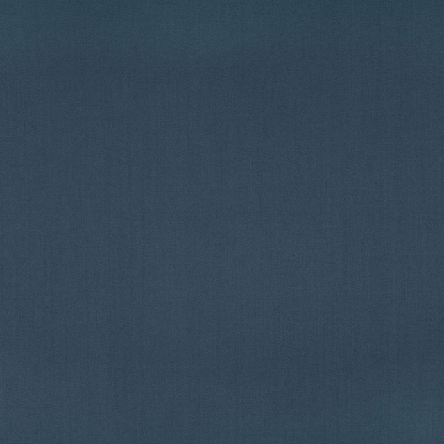 Deep indigo blue fabric with a fine, subtly tonal plain weave