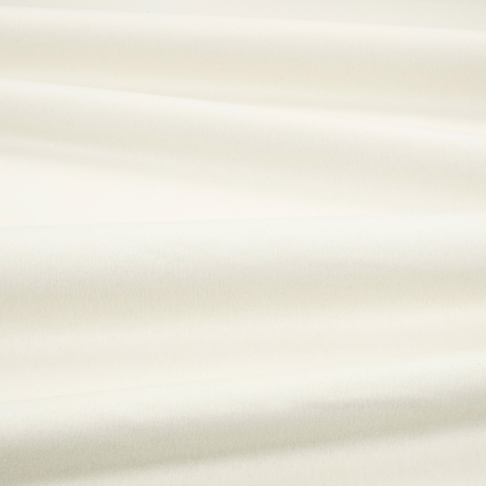 Pale ivory fabric swatch with smooth plush texture and softly shifting horizontal sheen