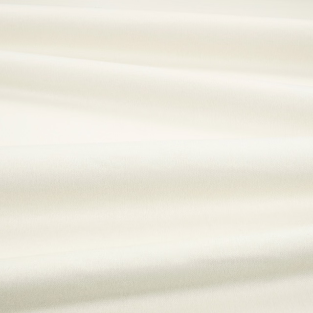Pale ivory fabric swatch with smooth plush texture and softly shifting horizontal sheen