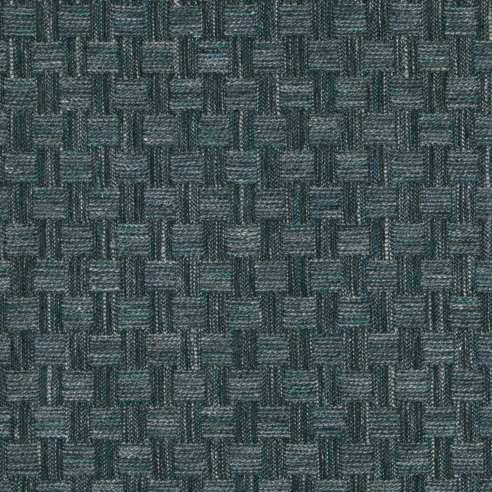 Close-up of deep peacock teal fabric with irregular basketweave blocks