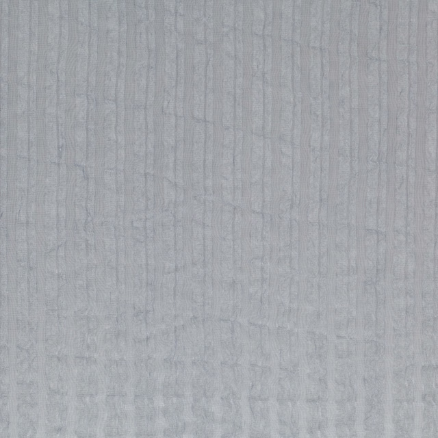 Pale blue-grey textile with fine vertical striations and softly mottled texture