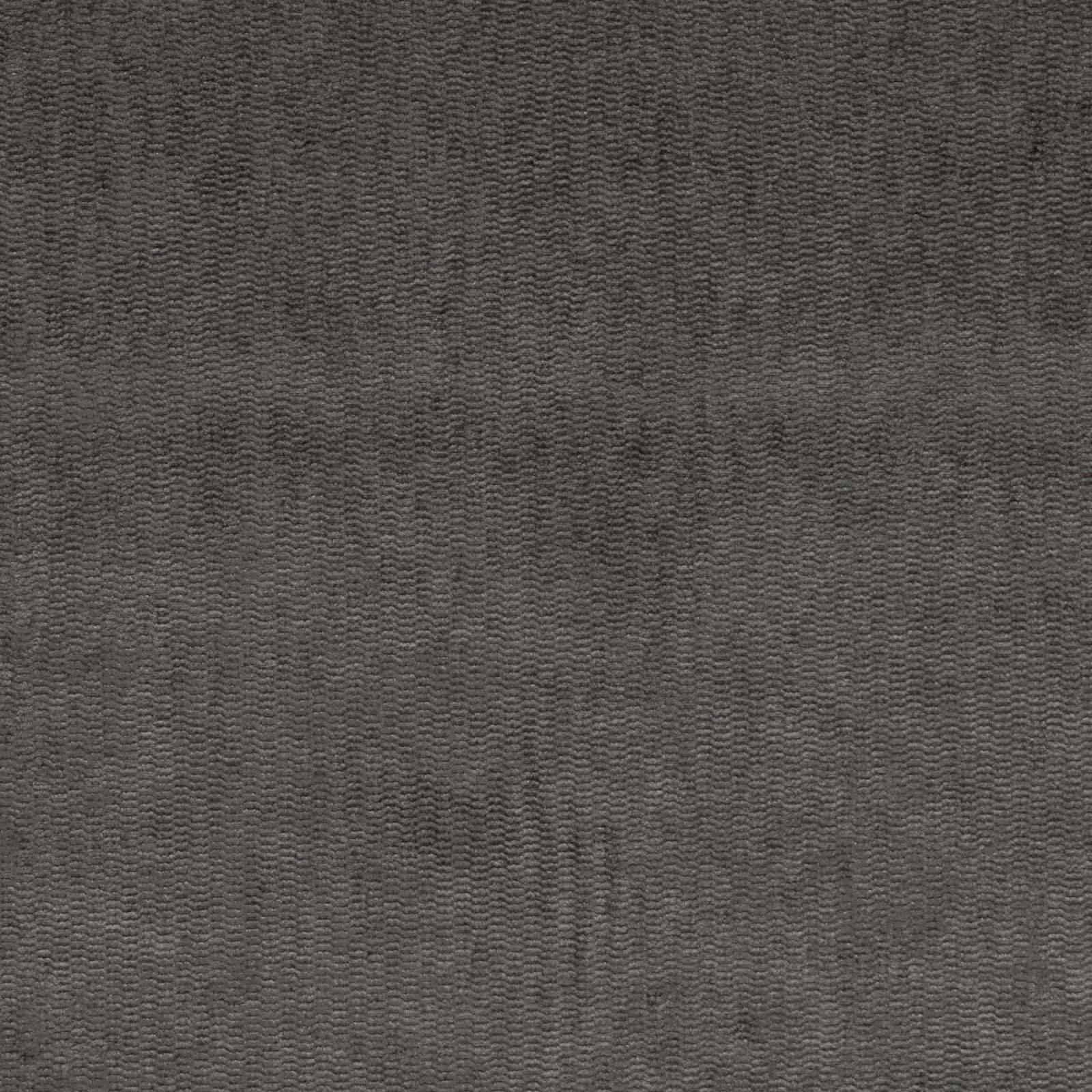 Close-up of deep charcoal fabric with fine mottled chevron-like woven texture