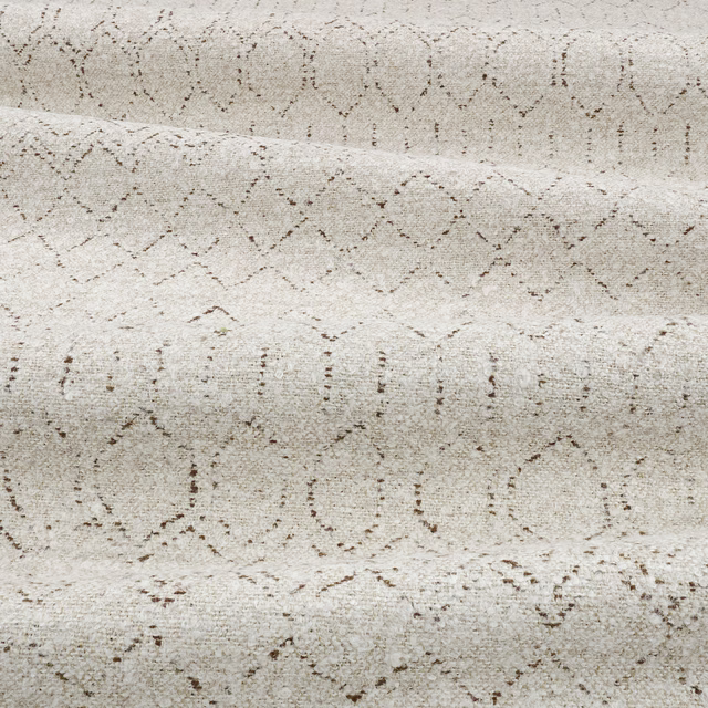 Pale parchment beige woven fabric with broken taupe diamonds and dotted lines