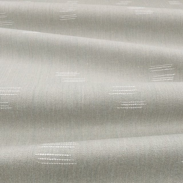 Pale cool-grey woven cloth with broken white horizontal dash motifs and soft sheen