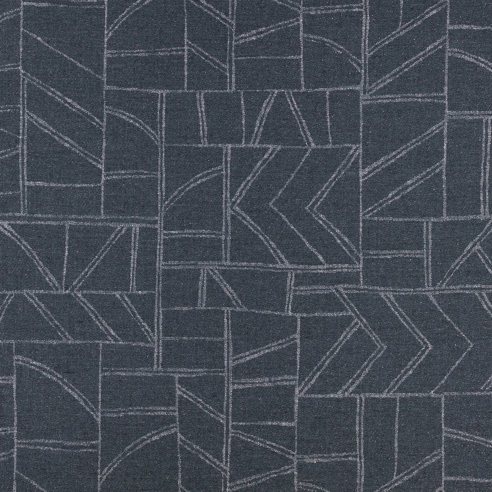 Deep indigo textile with pale angular lines forming a geometric patchwork