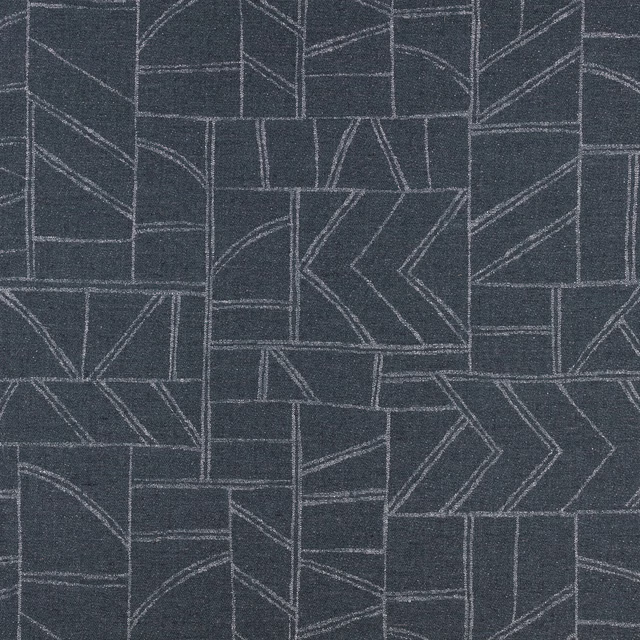 Deep indigo textile with pale angular lines forming a geometric patchwork