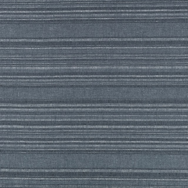 Close-up of indigo-blue woven fabric with irregular horizontal grey striations