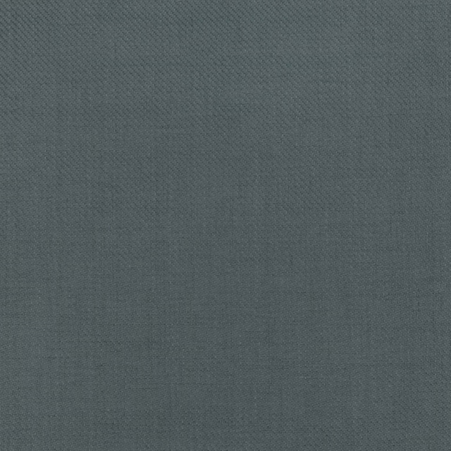Deep blue-grey wallpaper with a fine, subtly crosshatched surface texture