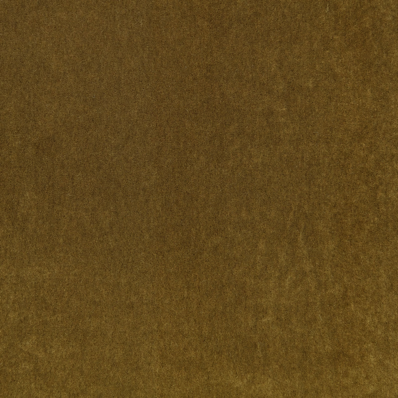 Warm cumin-brown plush textile showing subtle olive-gold tonal variation across its soft pile