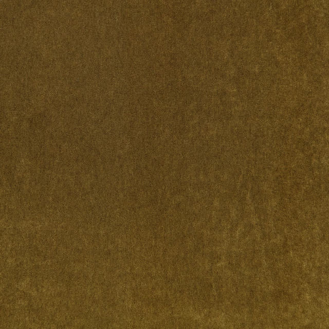 Warm cumin-brown plush textile showing subtle olive-gold tonal variation across its soft pile
