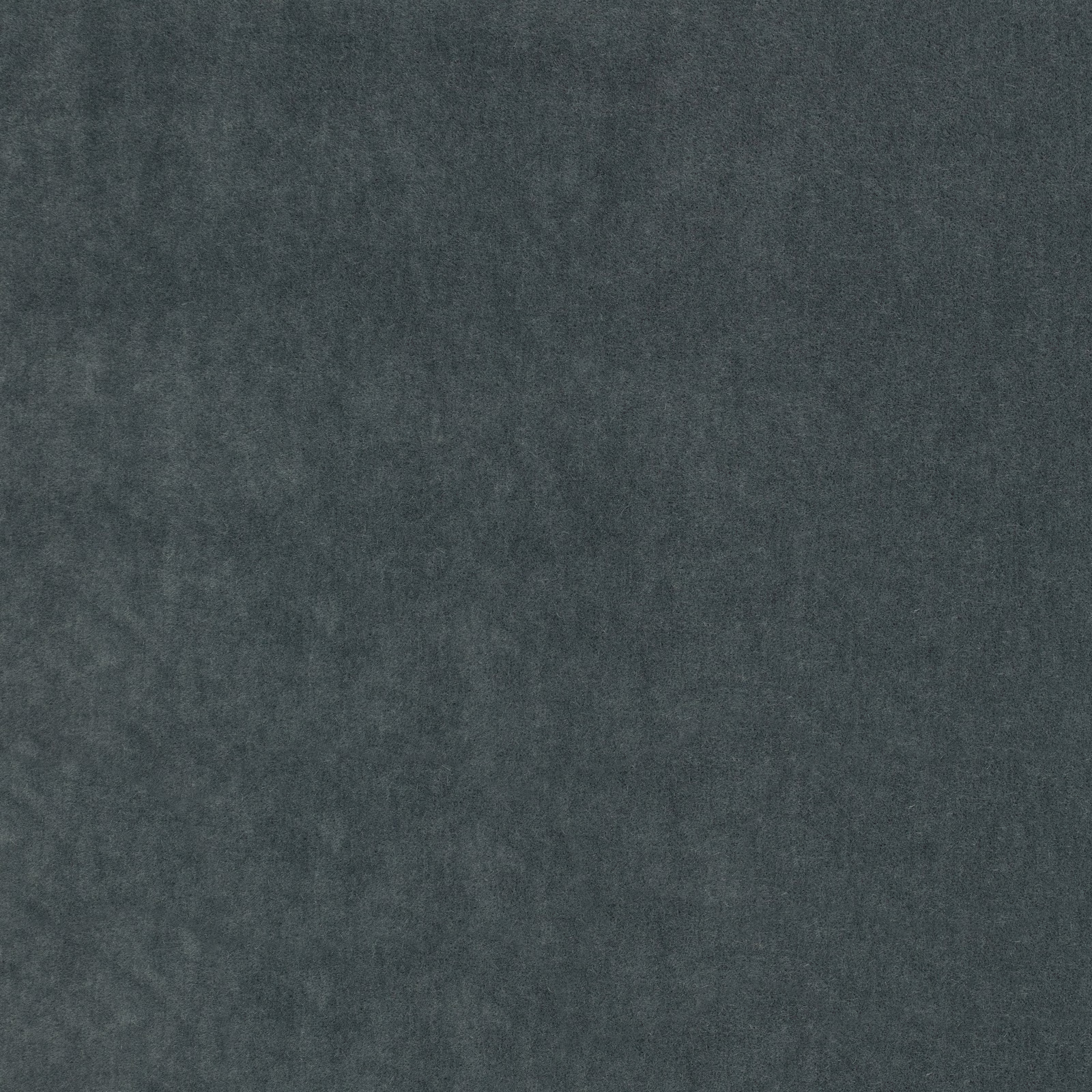 Close view of dark ink blue-grey plush fabric with softly mottled nap