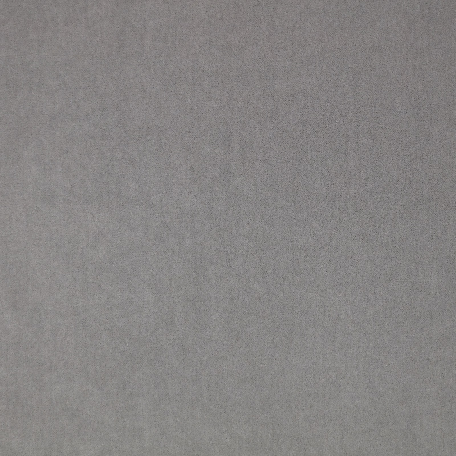 Close-up of soft lead-grey plush fabric with subtle nap and tonal shading