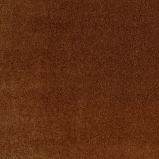 Warm sienna-brown plush fabric swatch with softly mottled, light-catching pile