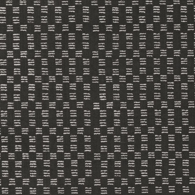 Charcoal woven fabric with irregular ivory dash motifs in vertical rows