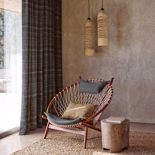 Deep peacock-teal curtain with narrow vertical ribs and a softly checked woven texture