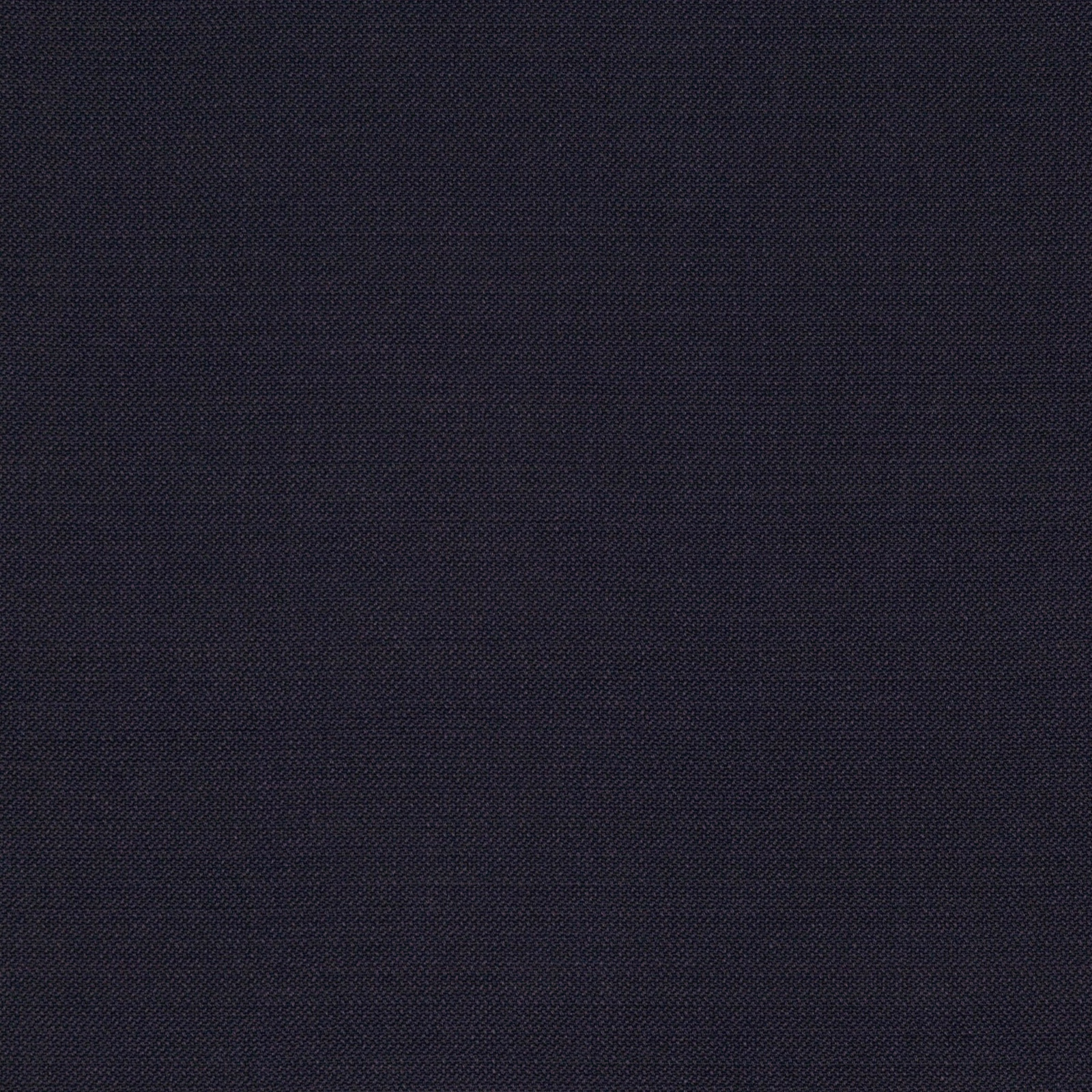 Close view of dark indigo fabric with a fine tonal crosshatch weave