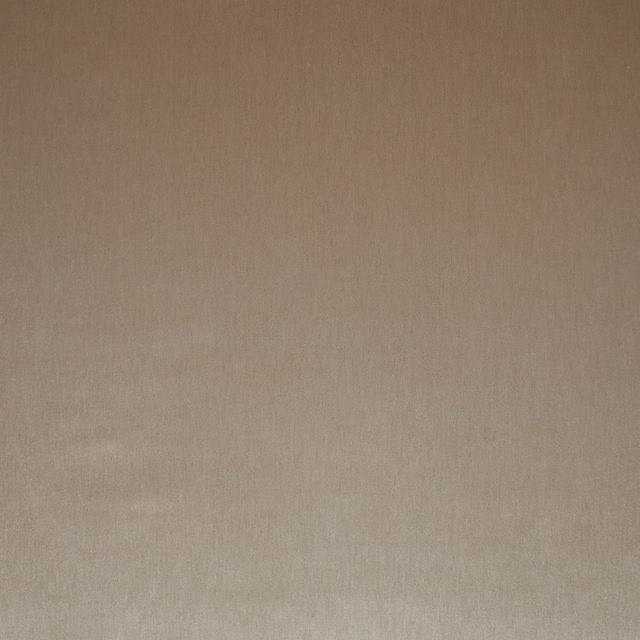 Close-up of warm eggshell beige plain fabric with fine texture and subtle sheen