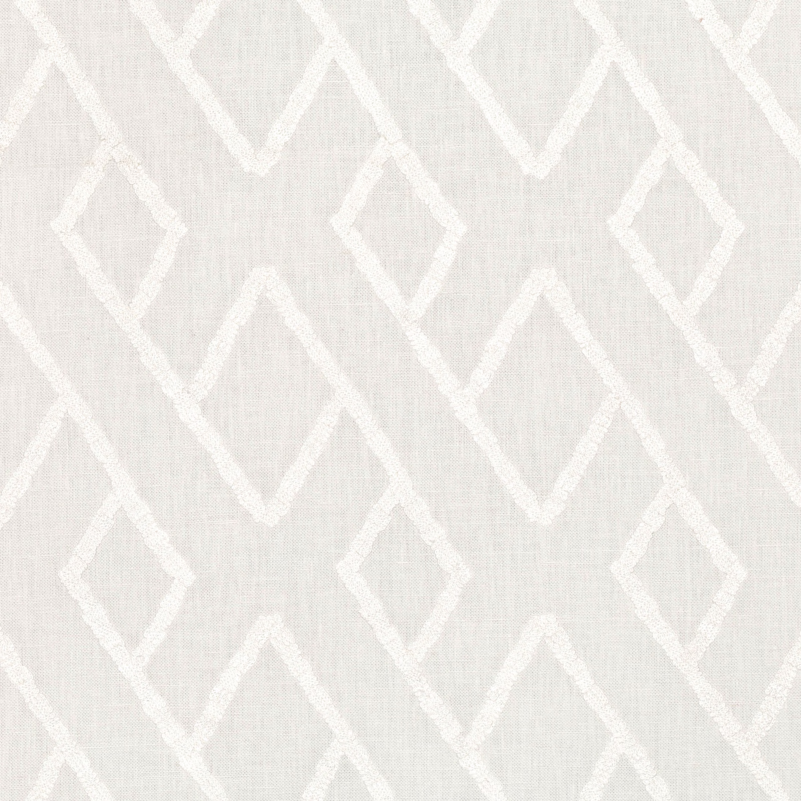 Ivory woven fabric with raised white diamonds and angular geometric embroidery