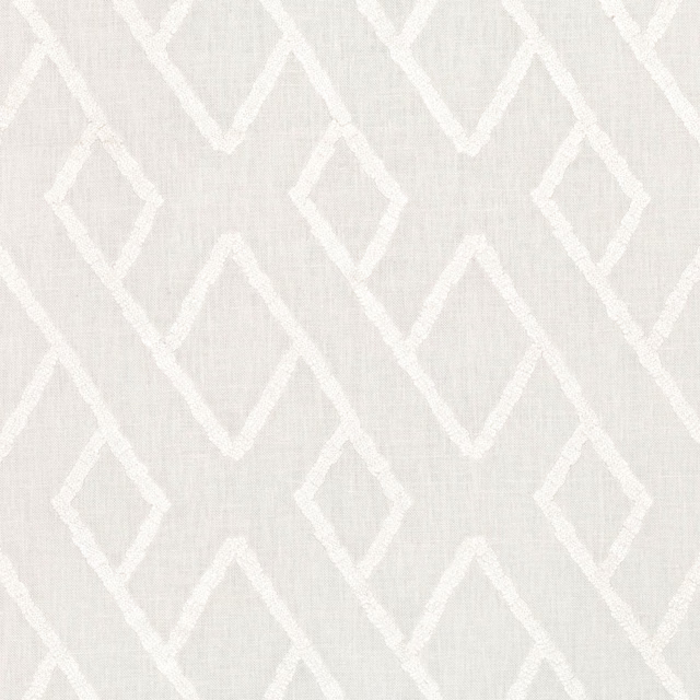 Ivory woven fabric with raised white diamonds and angular geometric embroidery