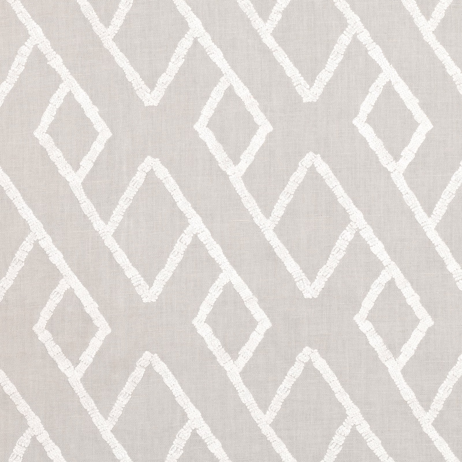 Pale silvery-grey woven ground with raised ivory interlocking diamond embroidery