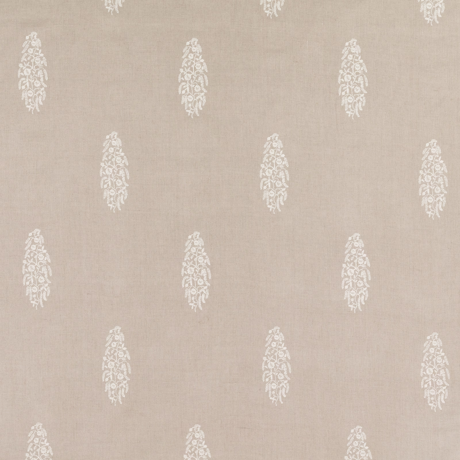 Warm flax-beige fabric with repeating ivory embroidered floral paisley motifs