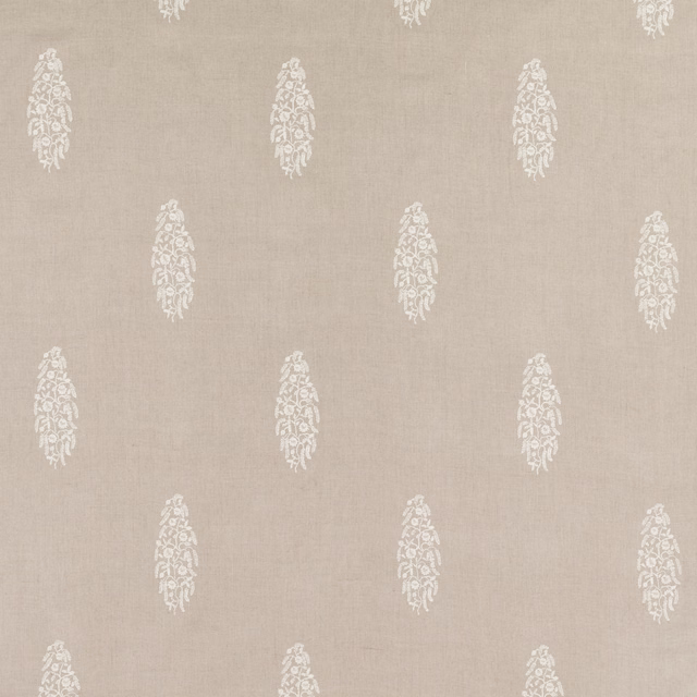 Warm flax-beige fabric with repeating ivory embroidered floral paisley motifs
