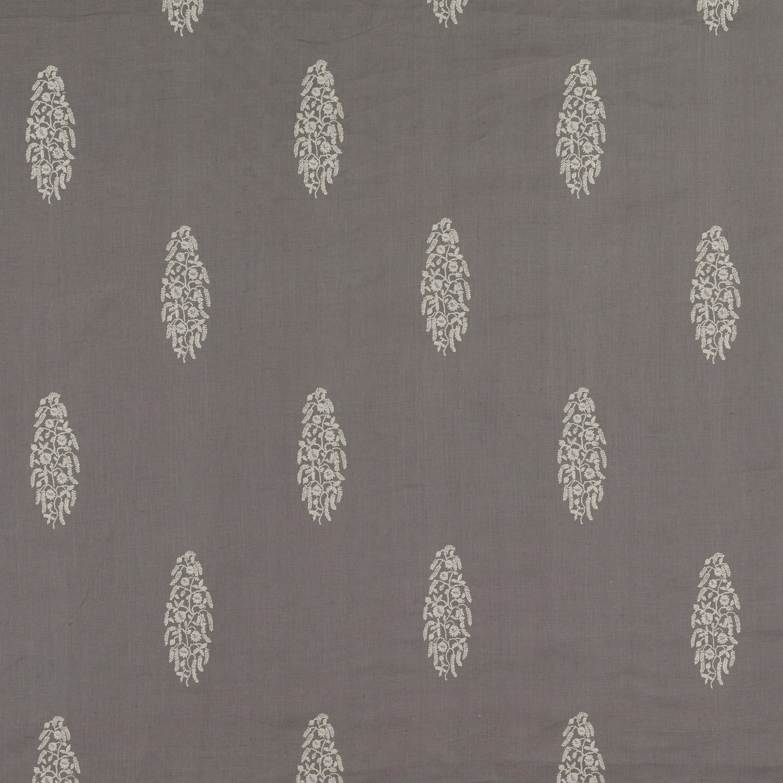 Cool gunmetal-grey woven ground with staggered cream elongated floral embroidery motifs