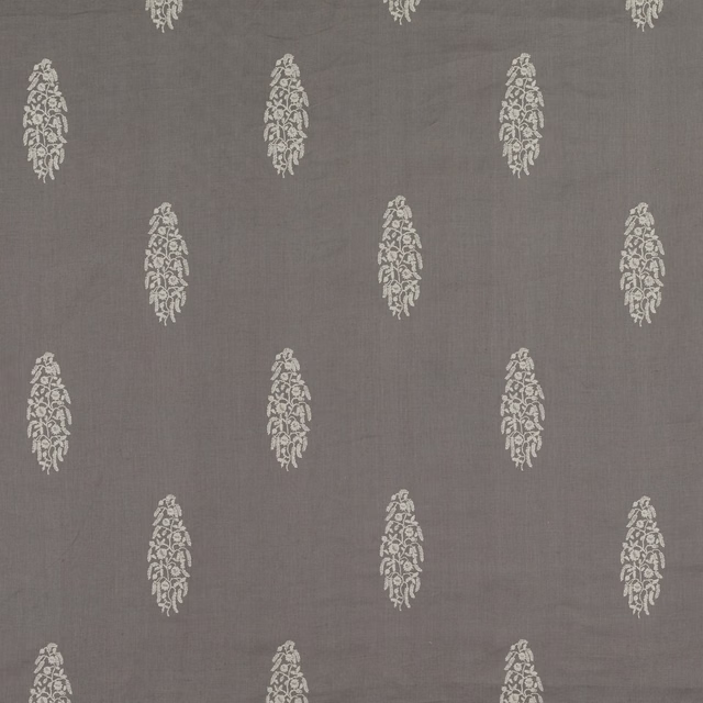 Cool gunmetal-grey woven ground with staggered cream elongated floral embroidery motifs