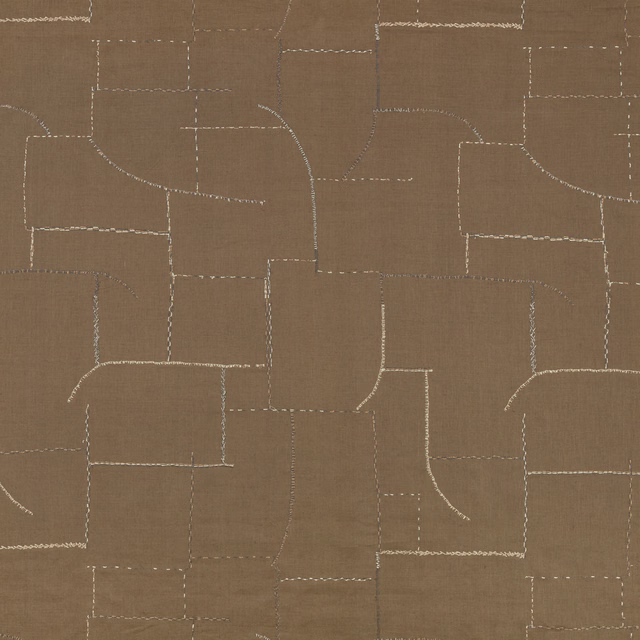 Warm cumin-brown textile with pale stitched geometric blocks and curved linework