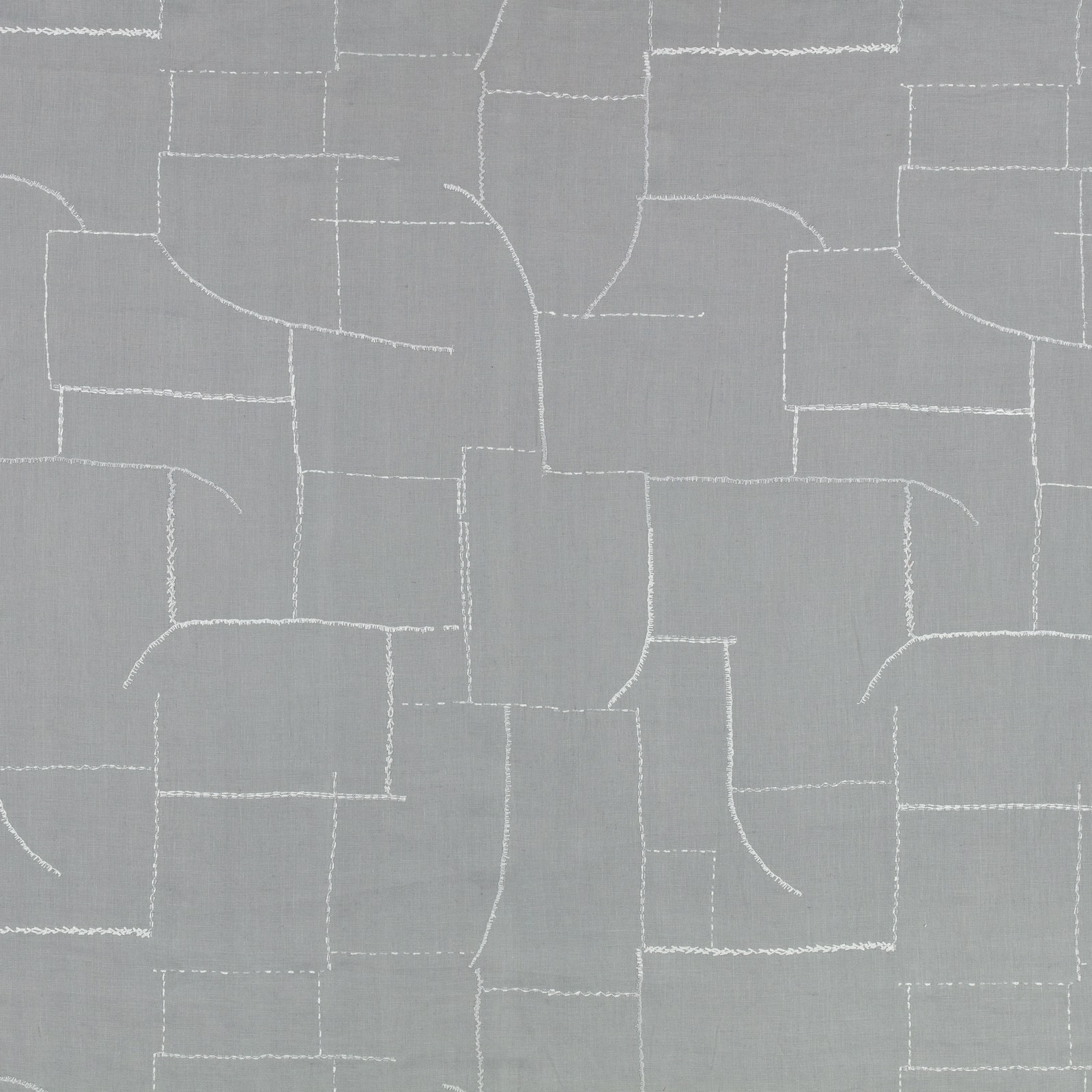 Muted blue-grey fabric with fine white embroidered geometric blocks and curved lines