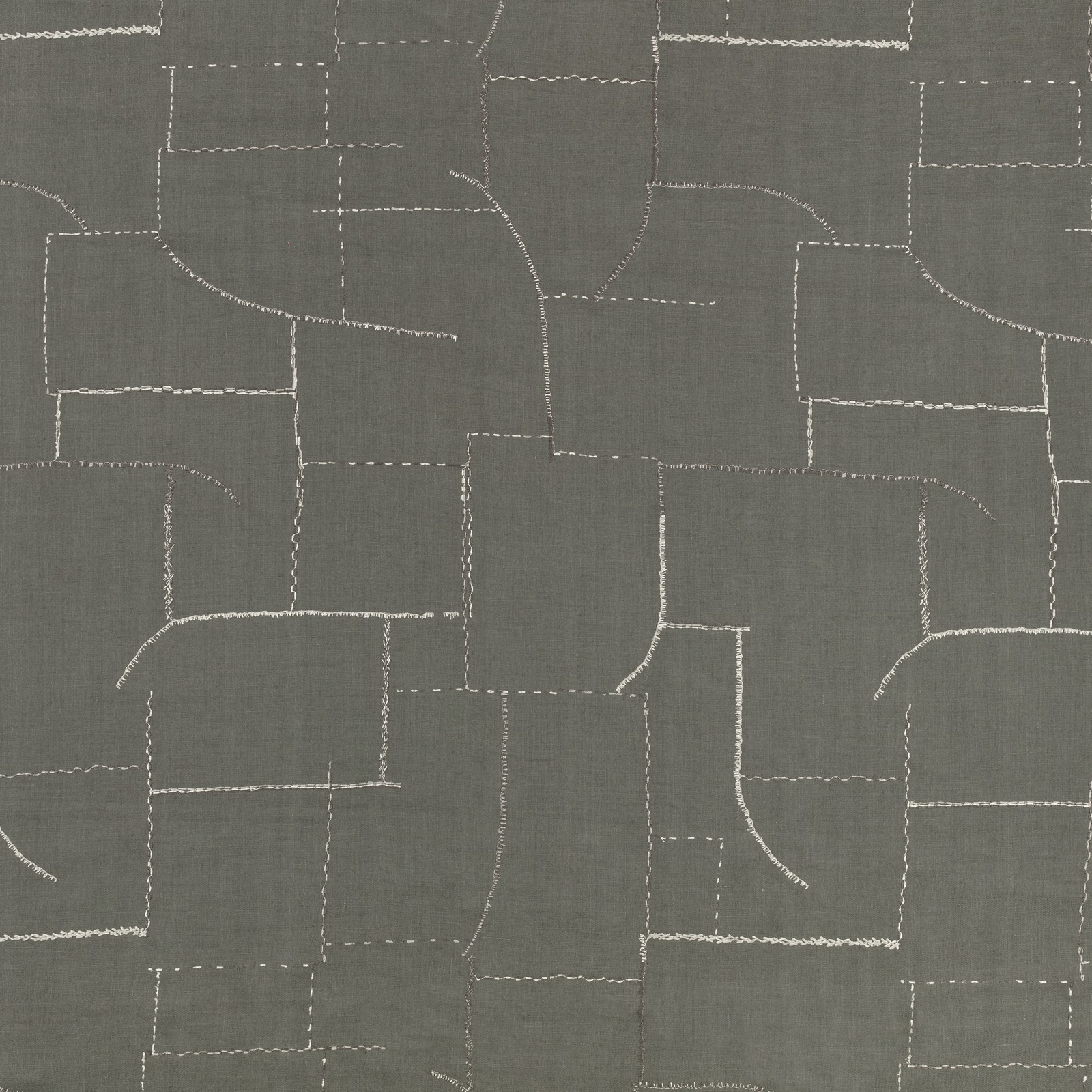 Metal-grey woven fabric with pale stitched, irregular patchwork lines