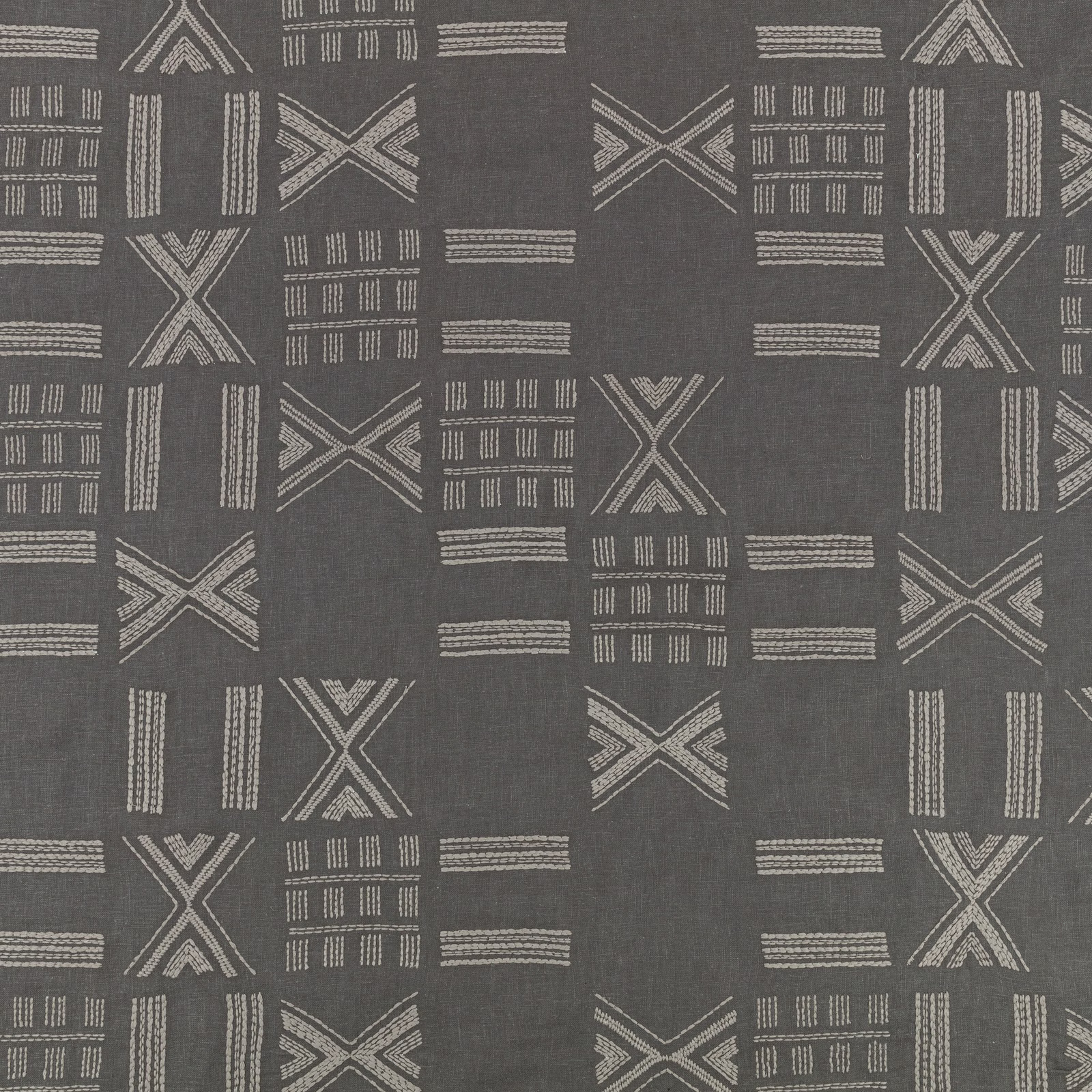 Anthracite-grey textile with pale linear X motifs, bars and block-like geometric marks