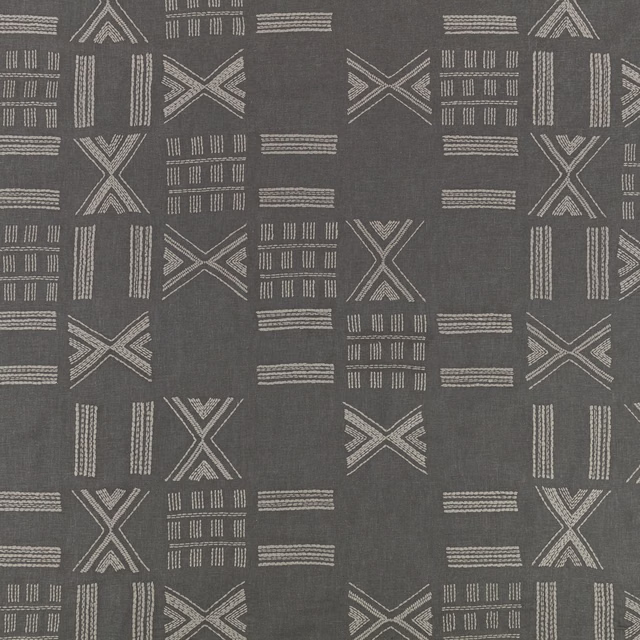 Anthracite-grey textile with pale linear X motifs, bars and block-like geometric marks