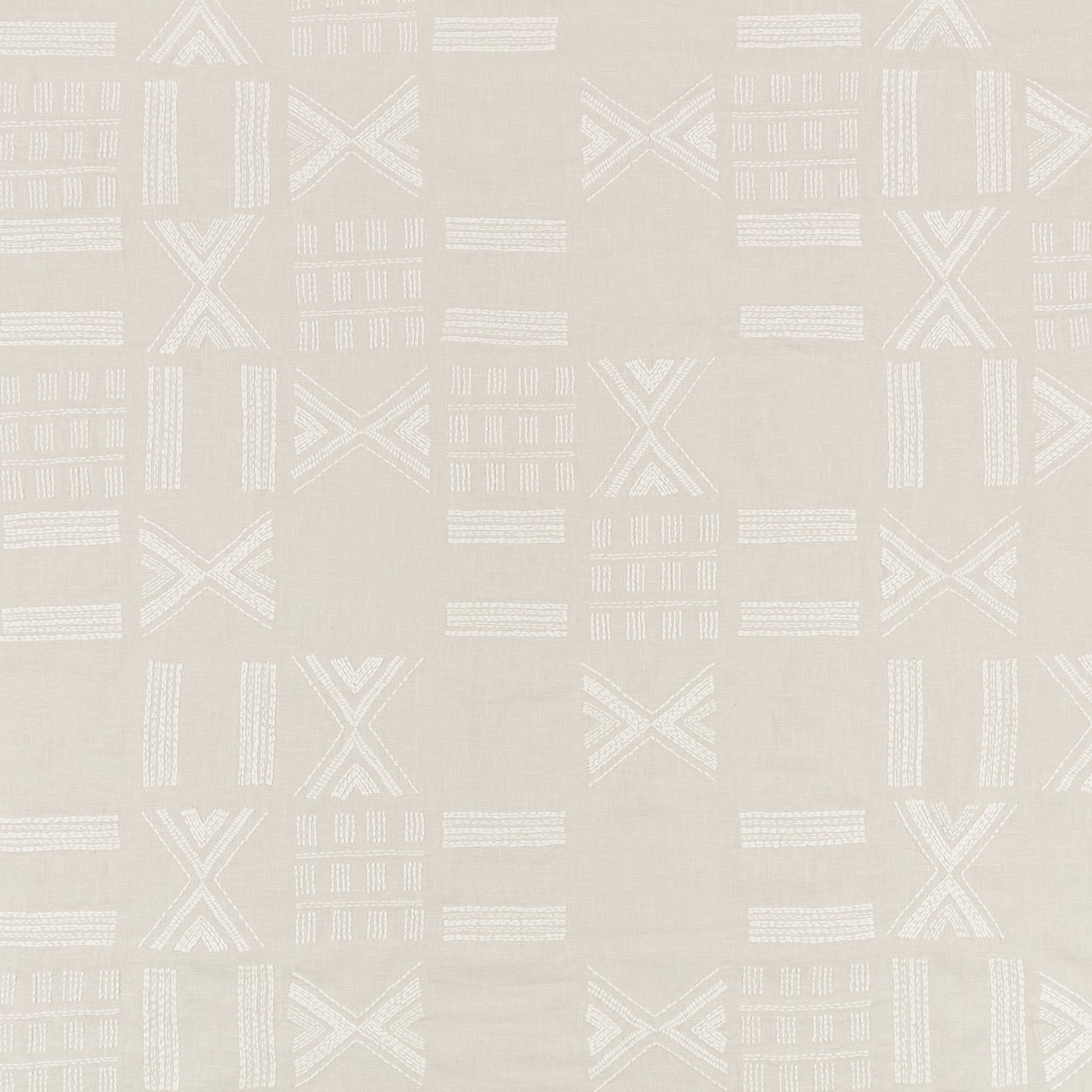 White-sand textile with ivory geometric X motifs and raised linear embroidery