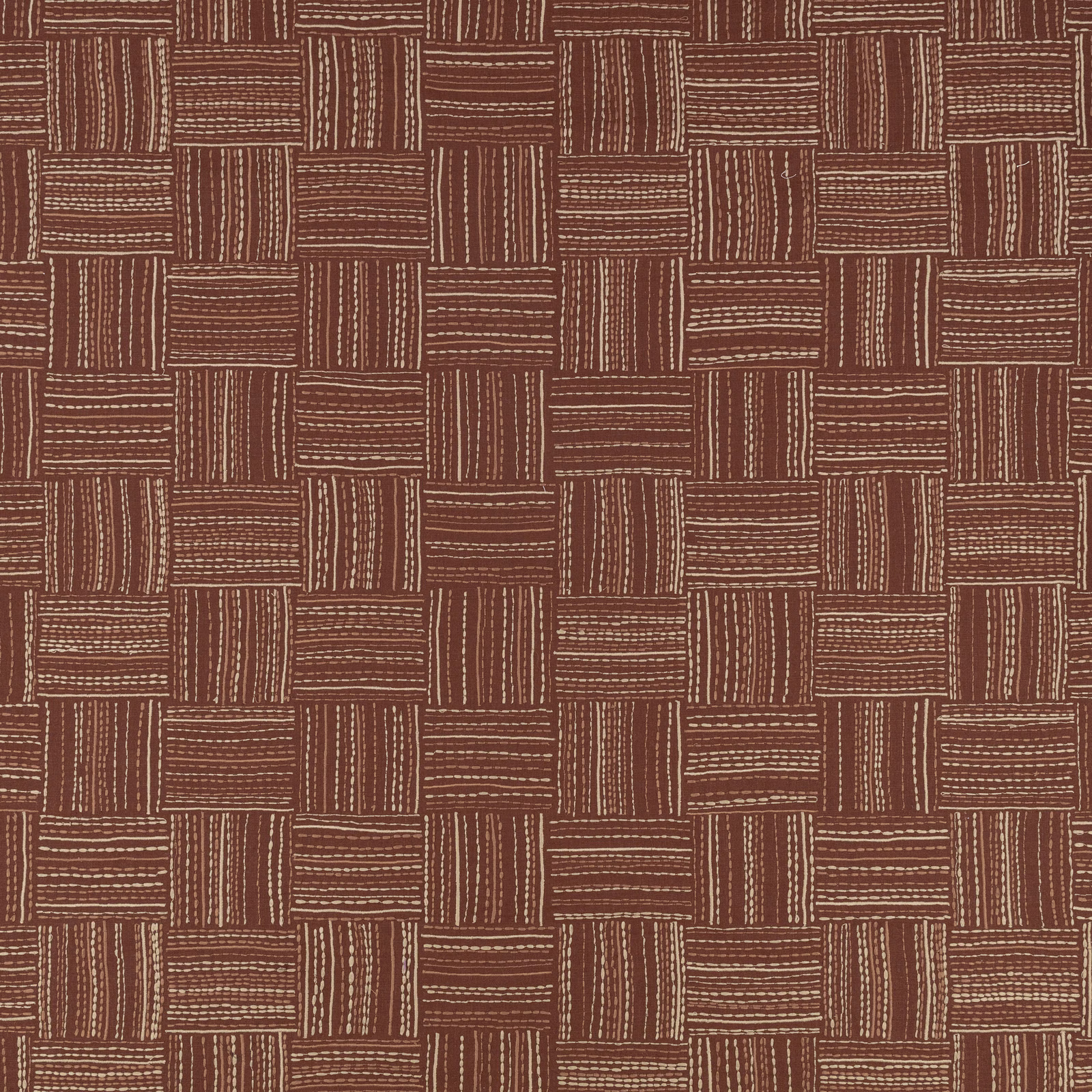 Warm sienna-brown fabric with cream embroidered lines forming a staggered rectangular grid