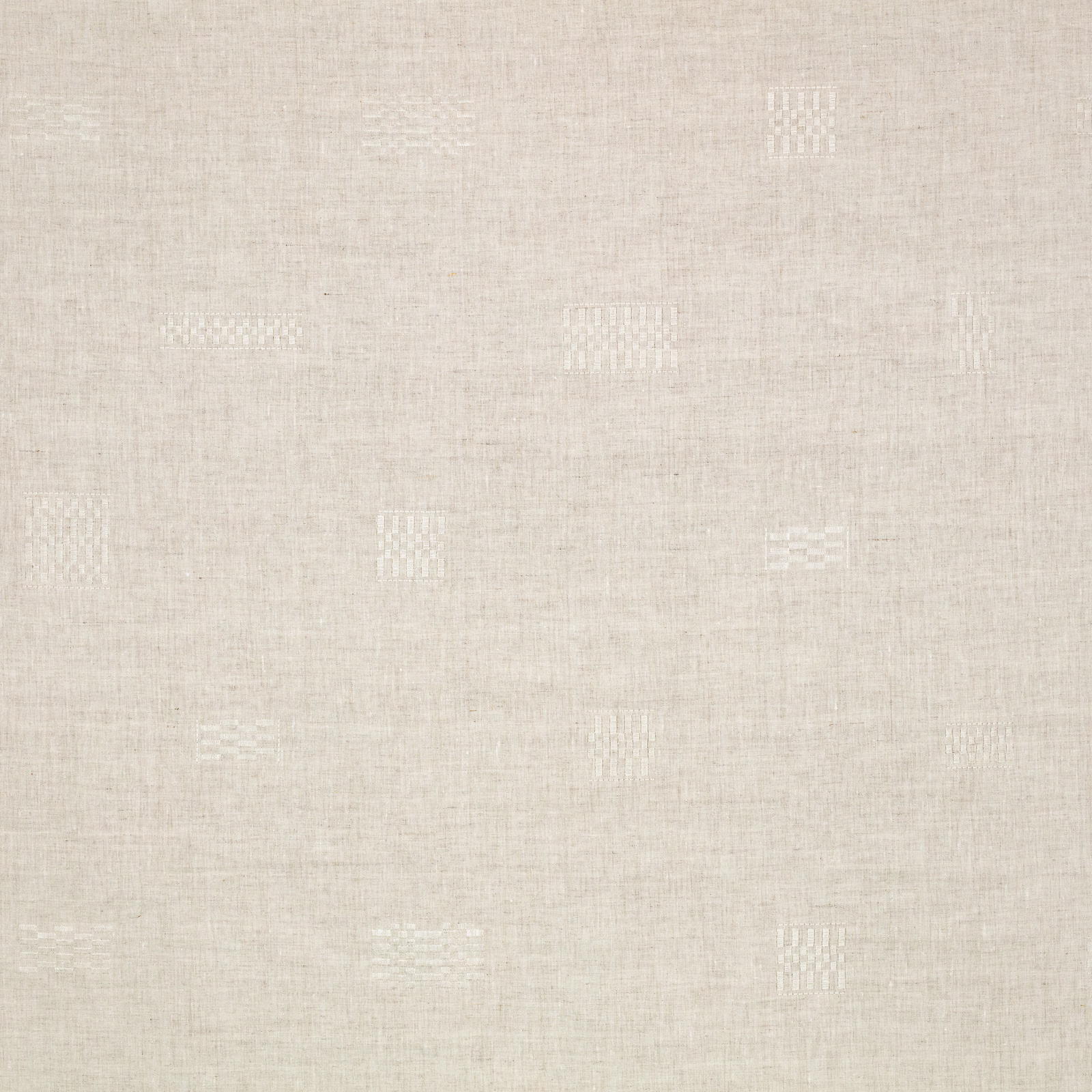 Pale sand woven fabric with scattered white geometric motifs and subtle slub texture