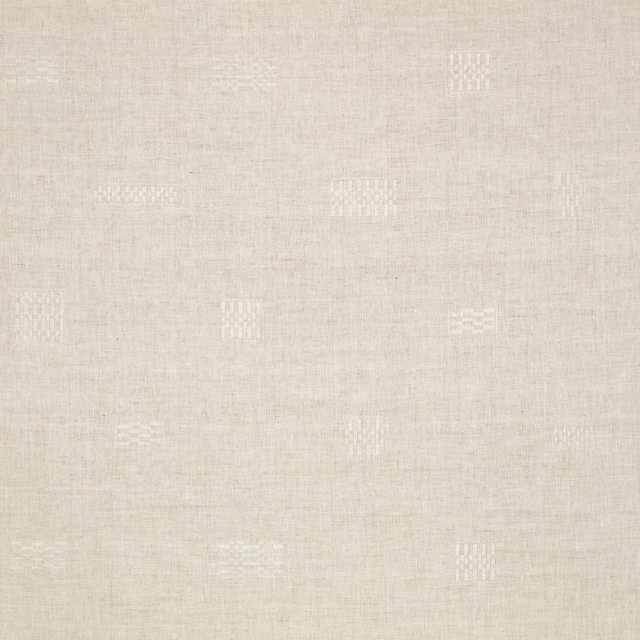 Pale sand woven fabric with scattered white geometric motifs and subtle slub texture