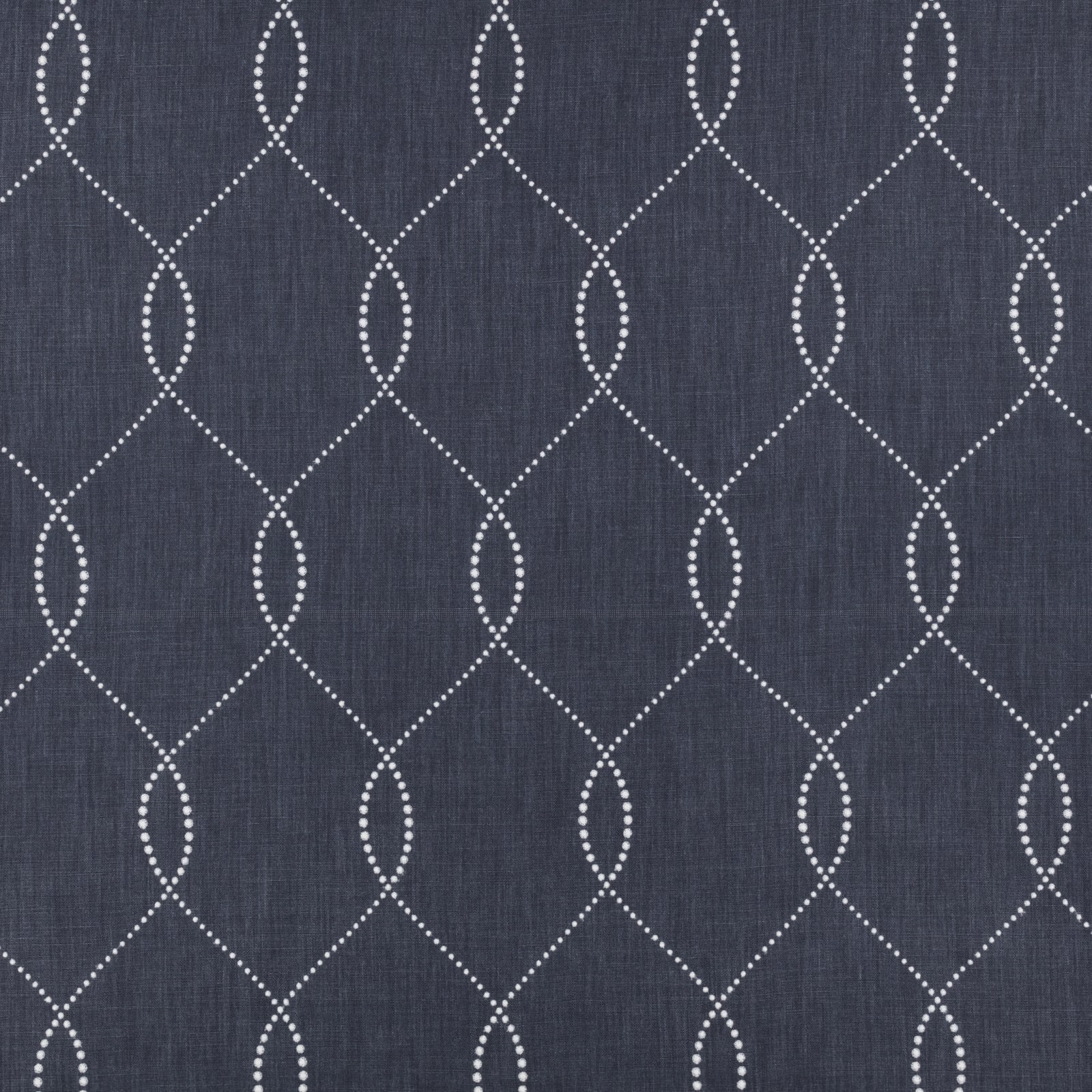 Deep indigo fabric with pale dotted ogee lattice and subtle vertical woven texture