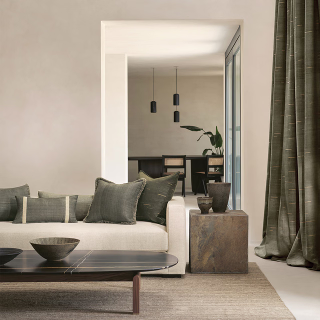 Deep olive-grey curtain with fine vertical texture and soft tailored folds